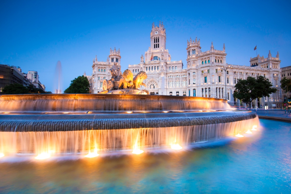 Fountain of Cybele in Madrid in the with two lions pulling a chariot and a 