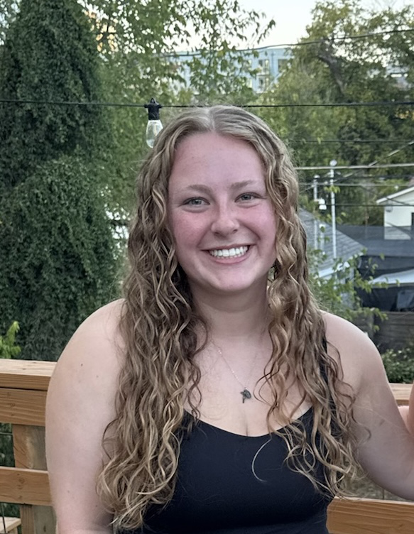 Deirdre smiling into the camera