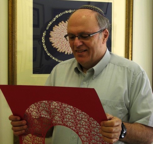 Archie Granot Archie Granot holds one of his papercuts