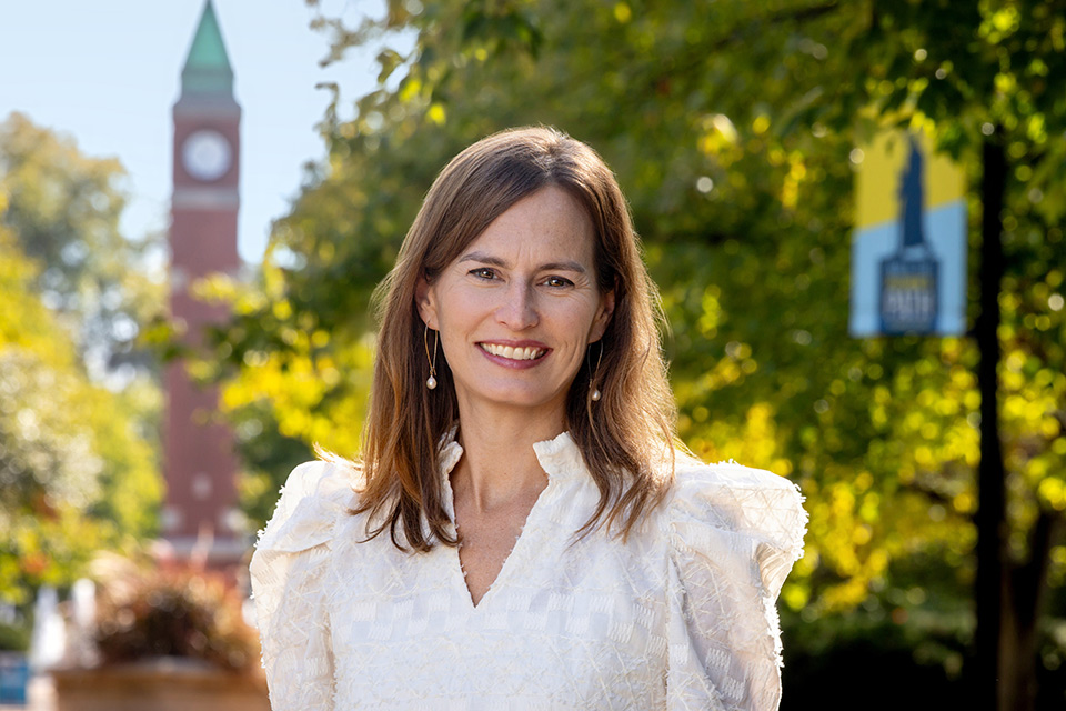 A headshot of Beth O'Leary taken in front of the SLU clock tower